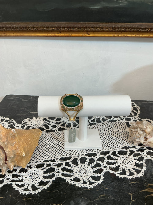 Bracciale rigido a fascia,in metallo dorato con finitura effetto bronzo,martellato e zigrinata